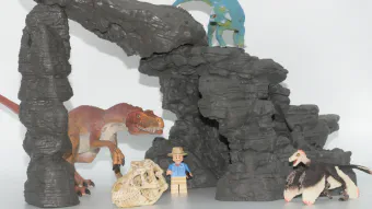 Image de couverture pour Kit de dinosaures avec grotte